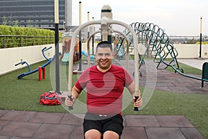 40-year-old Latino man exercises on the roof garden of his apartment building to prevent overweight, diabetes and hypertension