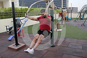 40-year-old Latino man exercises on the roof garden of his apartment building to prevent overweight, diabetes and hypertension