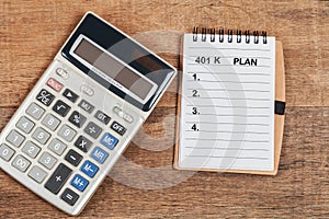 401 K plan list with calculator on wood