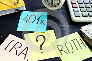 401k ira roth on pieces of paper. Retirement planning.