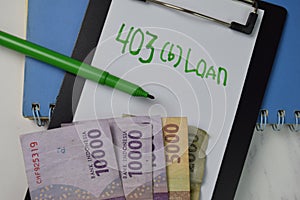 403 b Loan text on paperwork and indonesian Currency isolated on office desk