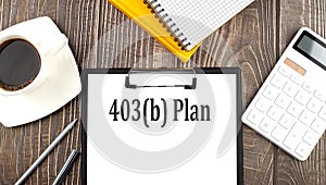 403b PLAN text on paper with coffee, calculator and notebook. Business concept