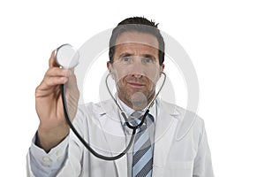 40s attractive male medicine doctor in medical gown with close up hand holding stethoscope smiling happy