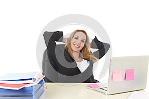 40s blond businesswoman working at office laptop computer relaxed and smiling happy
