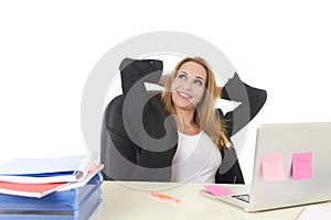 40s blond businesswoman working at office laptop computer relaxed and smiling happy