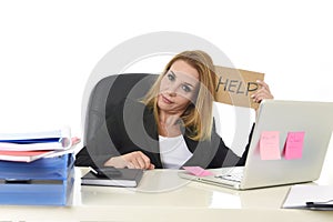 40s businesswoman holding help sign working desparate suffering