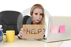 40s businesswoman holding help sign working desparate suffering