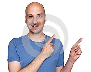 40s happy bald man pointing his fingers aside