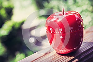 45 Minute Kitchen Egg Timer in Apple Shape Standing On A Handrail