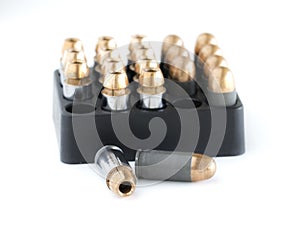 .45 Pistol bullets in a cartridge holder.
