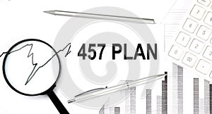 457 PLAN text on document with pen,graph and magnifier,calculator