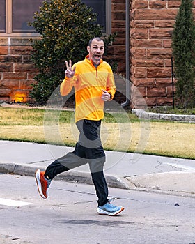 46 year-old Caucasian man performing a short warm up run before the 5K Turkey Trot in Edmond, Oklahoma, on Thanksgiving Day.