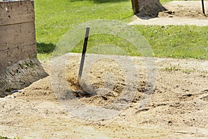 465 Flying sand as the Horseshoe ringer is made. photo