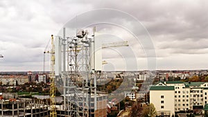 4G and 5G telecommunications tower cellular network antenna on the roof of a building. Aerial view