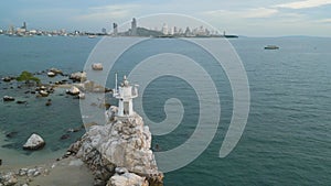 4k 60s drone orbit footage of Ko Chun lighthouse Pattaya Ko Chun island Thailand daylight