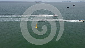 4K Aerial bird eyes view of speed boat cruising in high speed