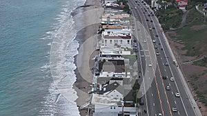 4K Aerial drone shot of Malibu Beach coastline in California with the blue Pacific Ocean