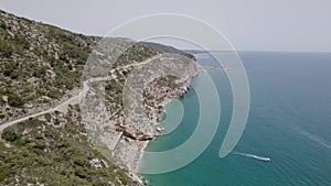 4K Aerial drone view of curves of Garraf coastal road near the sea
