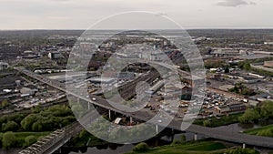 4K aerial following a passenger train into the city of Doncaster