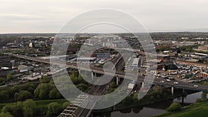 4K aerial following a passenger train into the city of Doncaster