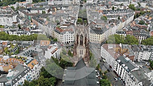 4k Aerial footage of the historic Saint Martin Church and surrounding area in Cologne, Germany.