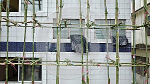 4K Aerial view of building exterior with scaffold