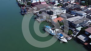 4K Aerial view of fisherman dock which has many ships anchoring for transport seafood