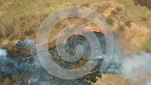 4K Aerial View Spring Dry Grass Burns During Drought Hot Weather. Bush Fire And Smoke. Firefighting Operation. Wild Open