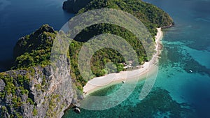 4K Aerial view of tropical beach on Dilumacad or Helicopter island. El Nido, Palawan Philippines. Blue lagoon, intact