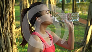 4K Asian Woman Drinking Water After Jogging In The Daan Park at Taipe City