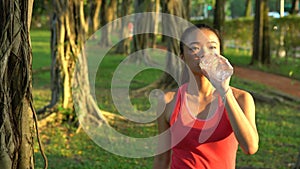 4K Asian Woman Drinking Water After Running In The Daan Park at Taipe City