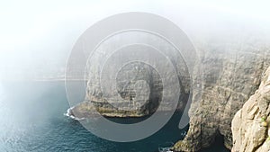 4K Beautiful view of foggy Traelanipan, Slave mountain in Vagar, Faroe Islands