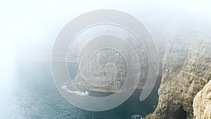4K Beautiful view of foggy Traelanipan, Slave mountain in Vagar, Faroe Islands
