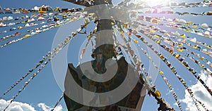 4k buddhist white stupa & flying prayer flags in shangrila yunnan,china.