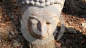 4K. Calm and peaceful face of old worship buddha statue head illuminated. Buddha statue at Chiangmai history temple.