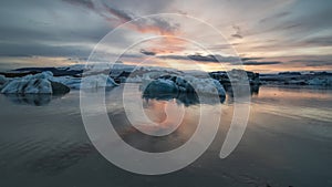 4K cinematic sunset time lapse footage of floating icebergs at Jokusarlon Glacial Lagoon
