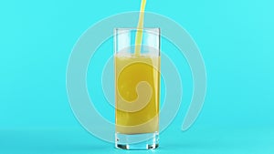 4K close-up shot of fruit orange multifruit juice cold beverage drink pooring into glass blue background in studio