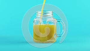 4K close-up shot of fruit orange multifruit juice cold beverage drink pooring into glass jar mug blue background in