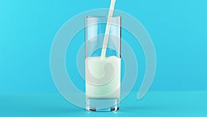 4K close-up shot of milk cold beverage drink pooring into glass blue background in studio