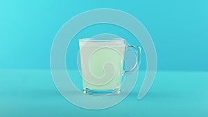 4K close-up shot of yellow lemon fizzy lemonade soda cold beverage drink pooring into glass mug with handle blue