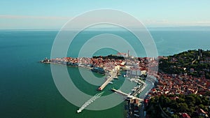 4K Compilation Video. Flight over old city Piran in the morning, aerial view with Tartini Square and St. George`s Parish Church