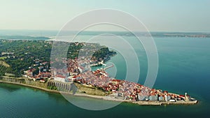 4K compilation video. Flight over old city Piran in the morning, aerial view with Tartini Square and St. George`s Parish Church