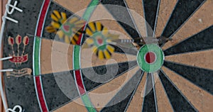 4K - Darts game. Close-up. Throwing darts at a dartboard.