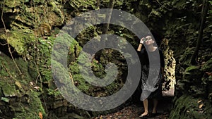 4k defile from the forest stone cave moss covered in black handmade skirt squares textures, deep in the green forest in