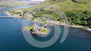 4k drone footage of the ancient Eilean Donan Castle overlooking Loch Duich in the Scottish Highlands