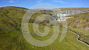 4k drone footage of Malham Cove a limestone landmark in the Yorkshire Dales