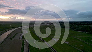 4k drone footage of a spectacular sunset over the River Waveney at Herringfleet, Suffolk