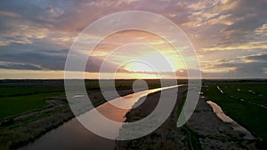 4k drone footage of a spectacular sunset over the River Waveney at Herringfleet, Suffolk