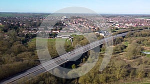 4k drone footage of traffic on a dual carriageway passing next to Stowmarket in Suffolk