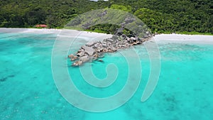 4K drone forward flight forwards gorgeous tropical paradise beaches Petite Anse and Grande Anse, La Digue Island